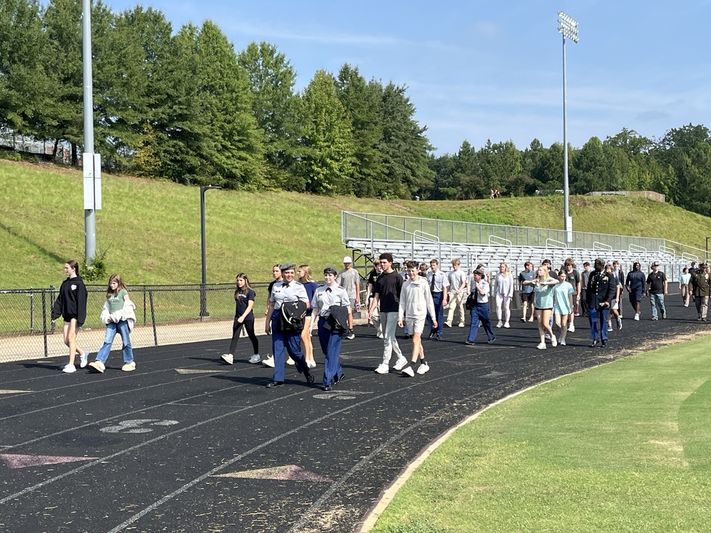 High school students walk laps to participate in a 9/11  remembrance ceremony held at the high school. 