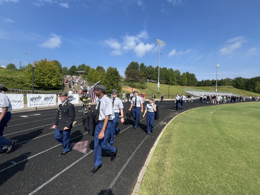 High school students walk laps to participate in a 9/11  remembrance ceremony held at the high school. 