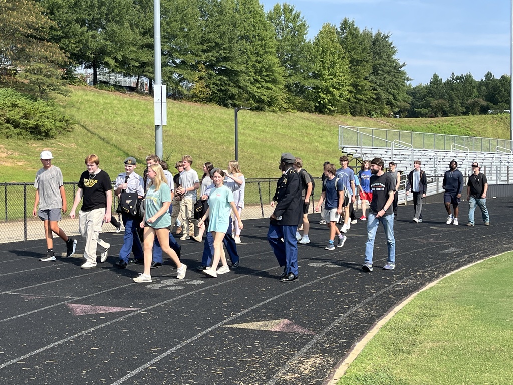 High school students walk laps to participate in a 9/11  remembrance ceremony held at the high school. 