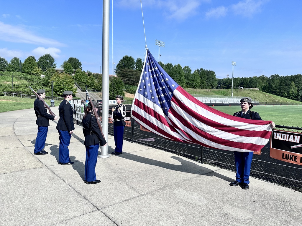 JROTC cadets raise the American flag during a 9/11  remembrance ceremony held at the high school. 