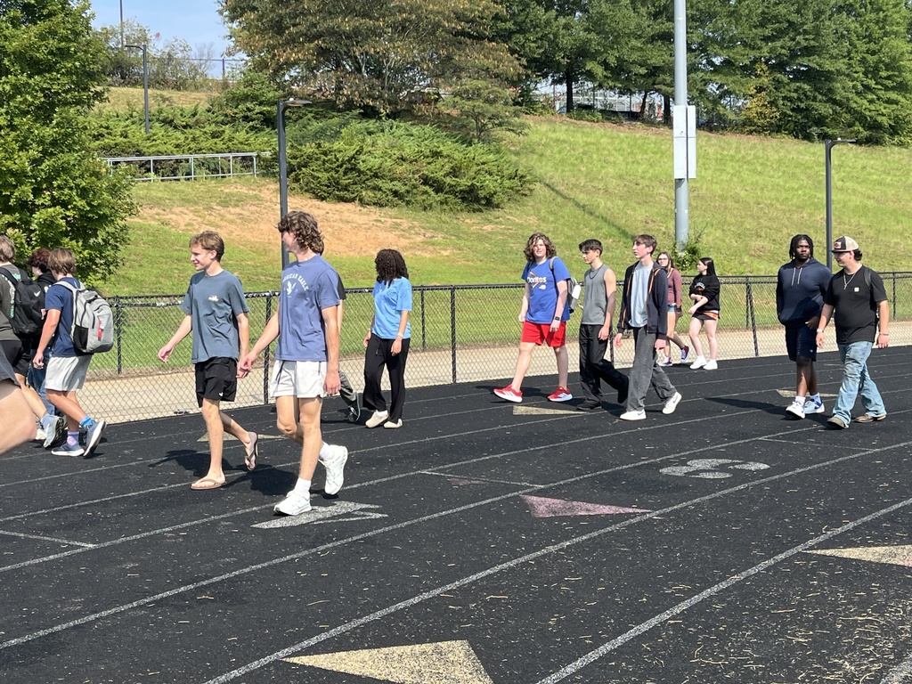High school students walk laps to participate in a 9/11  remembrance ceremony held at the high school. 