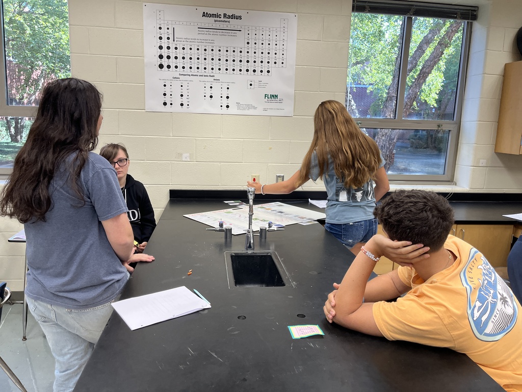 Chemistry students participate in a station exercise where they practice classifying the different types of matter. 