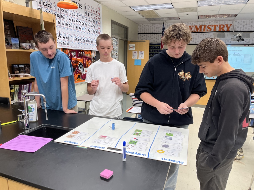 Chemistry students participate in a station exercise where they practice classifying the different types of matter. 