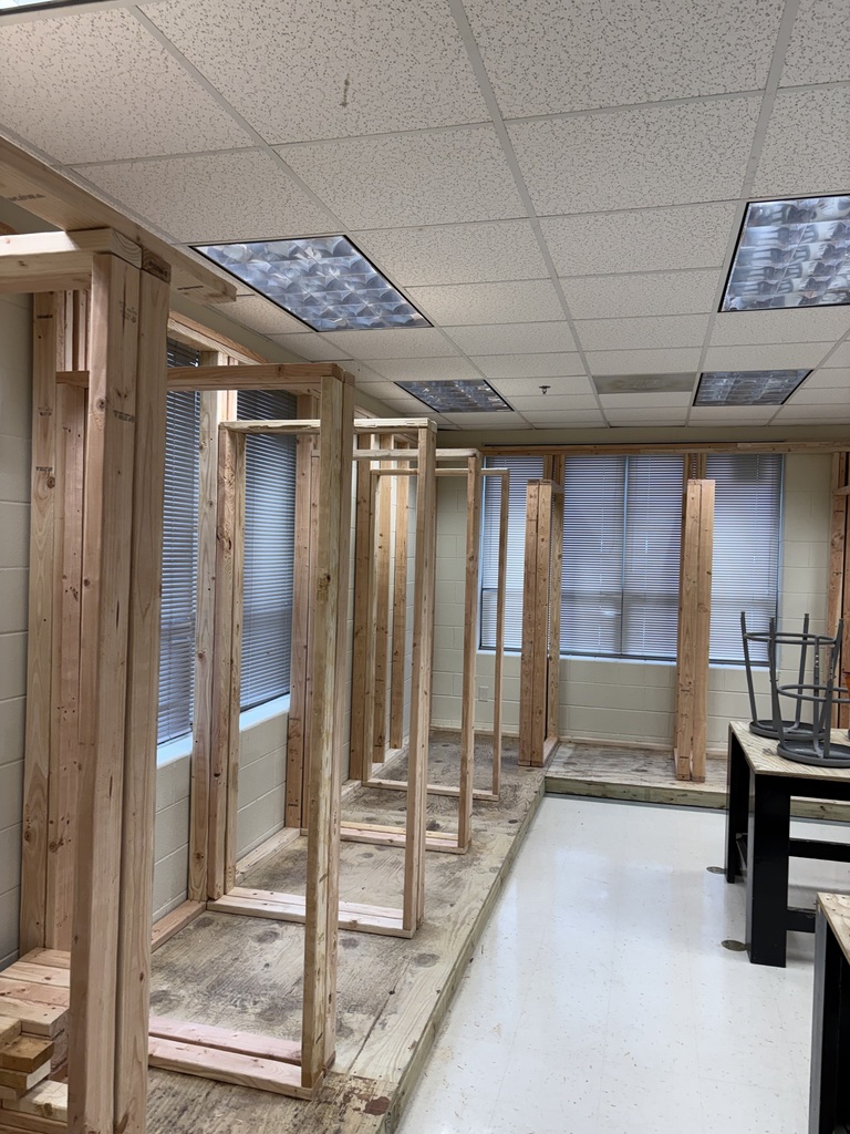 Electricity booths being built in a classroom.