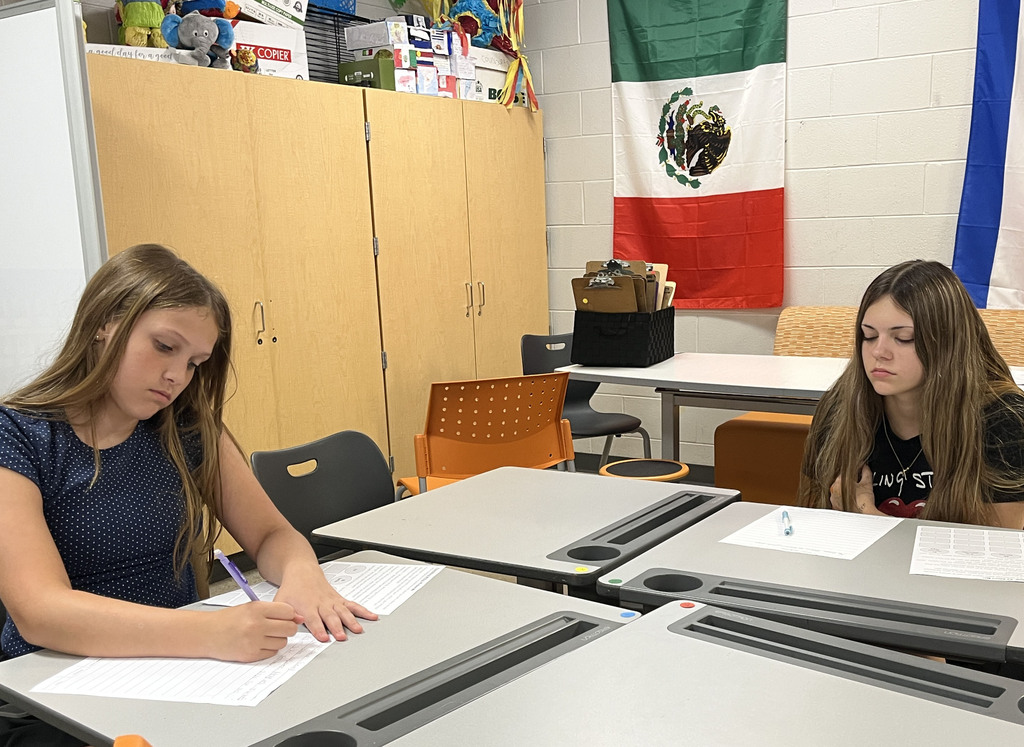 Students take an assessment in Spanish class to see what they know.
