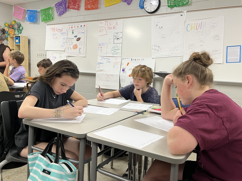Students take an assessment in Spanish class to see what they know.