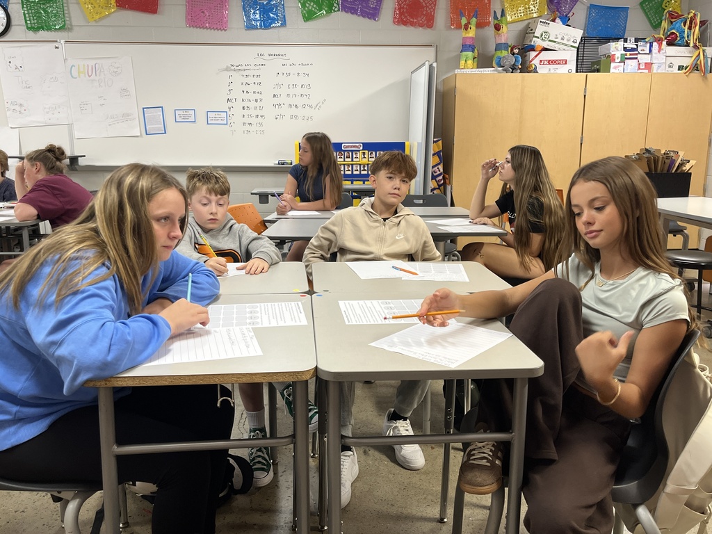 Students take an assessment in Spanish class to see what they know.