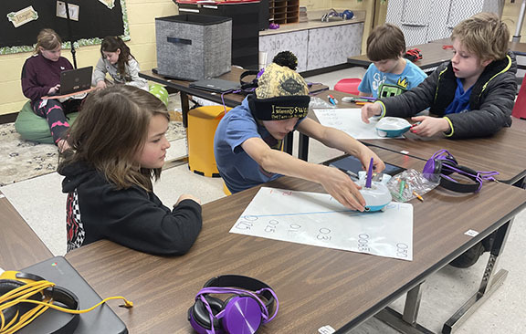 Students use a Finch Robot to review math skills.