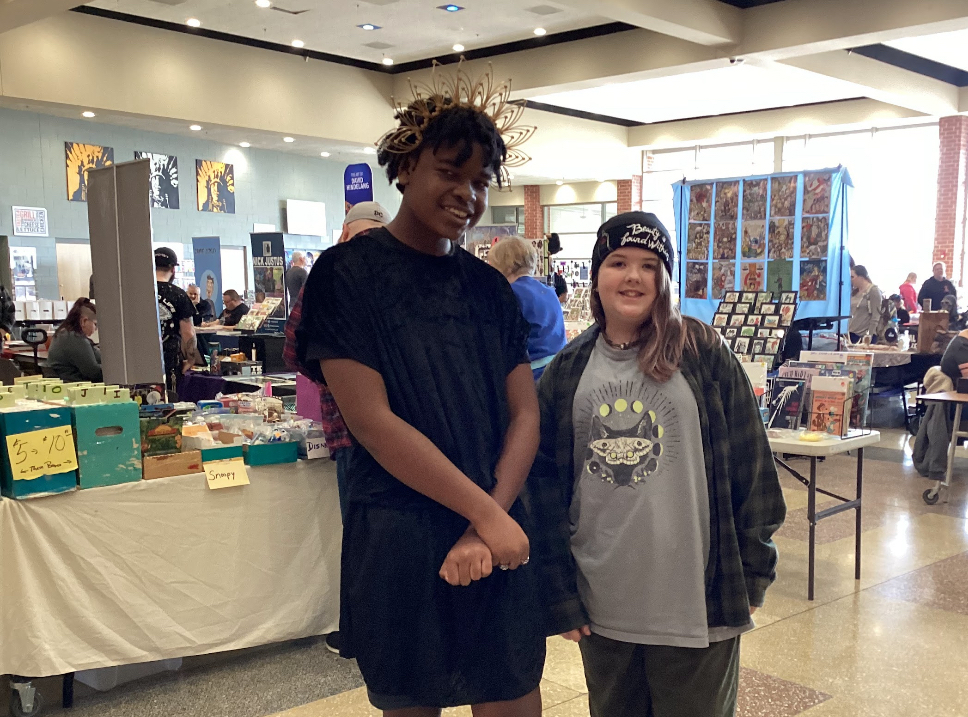 Two people in costume pose for a photo.