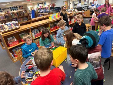 A group of children play with Legos