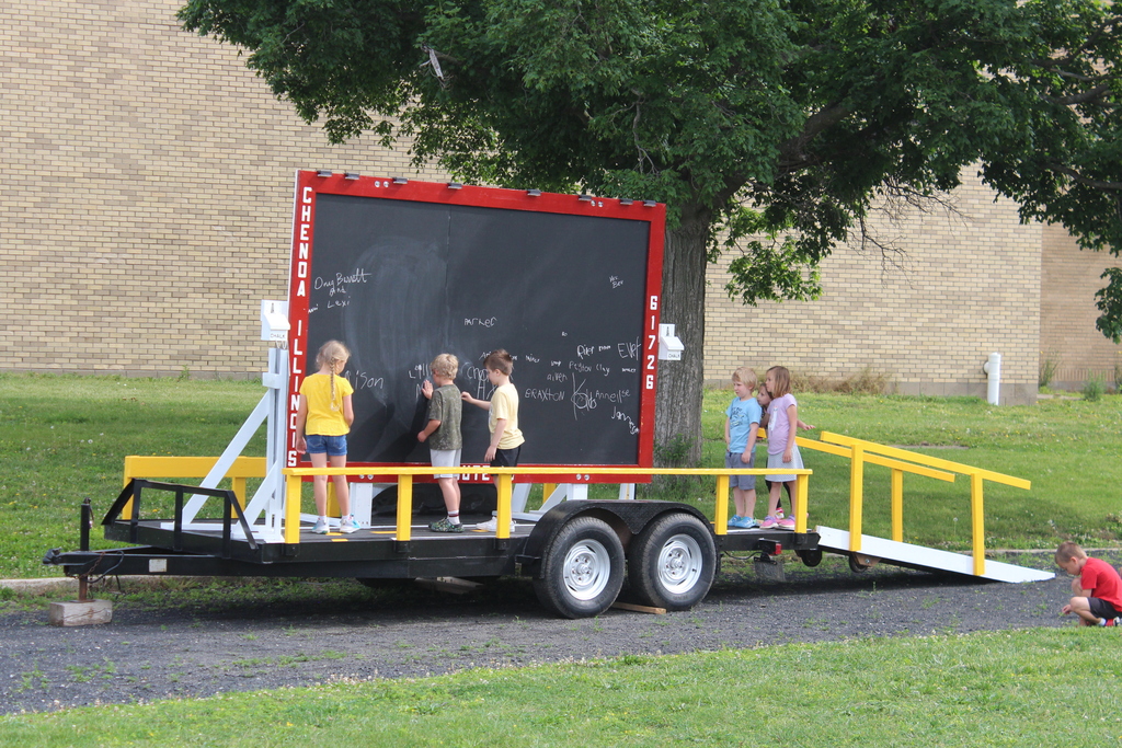 Kids signing a board