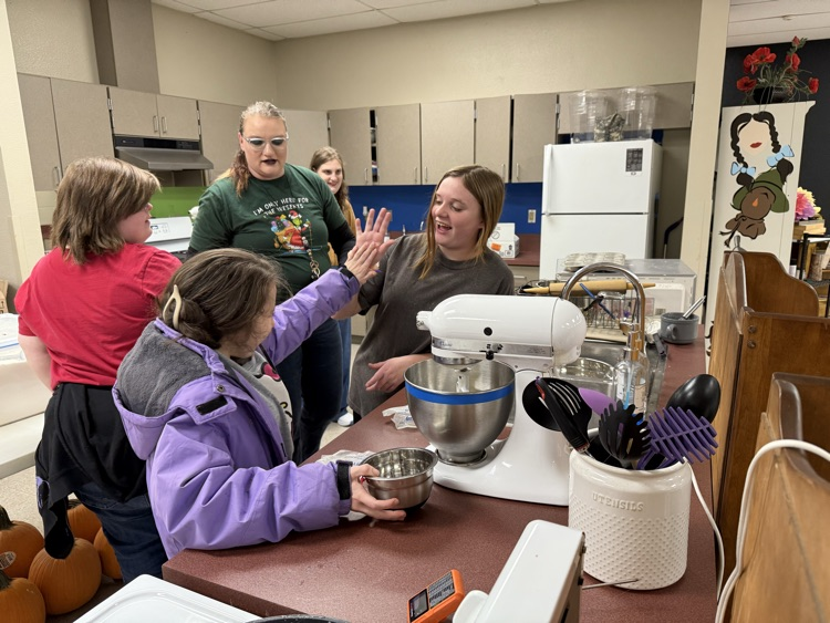 students baking cookie dough 