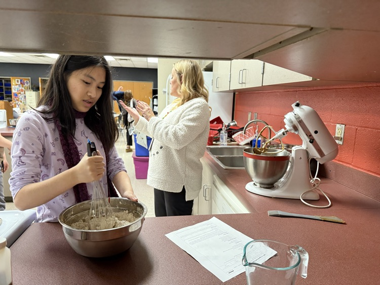 students baking cookie dough 
