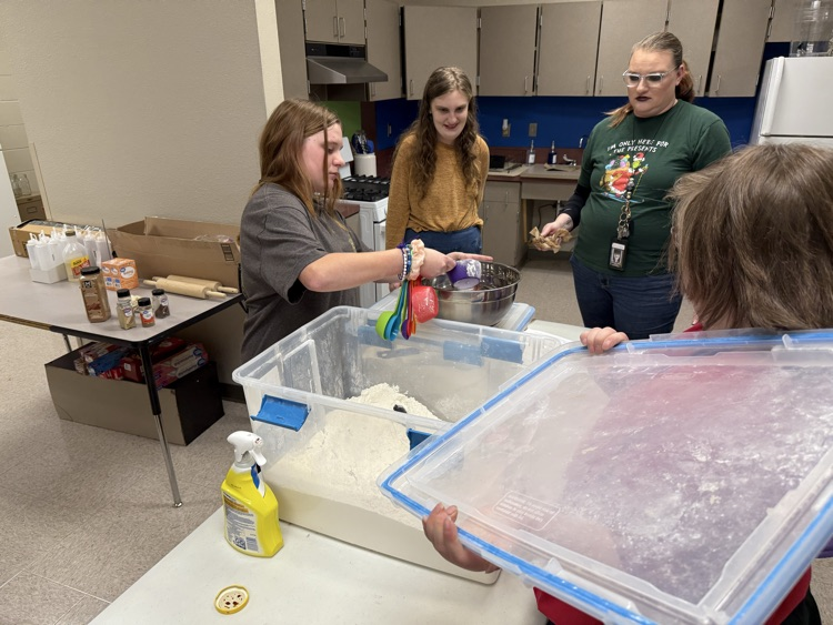 students baking cookie dough 