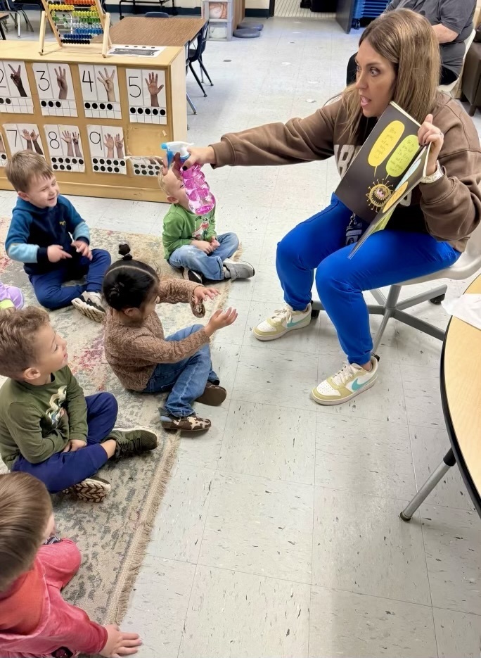 nurse amber reading to preschool class