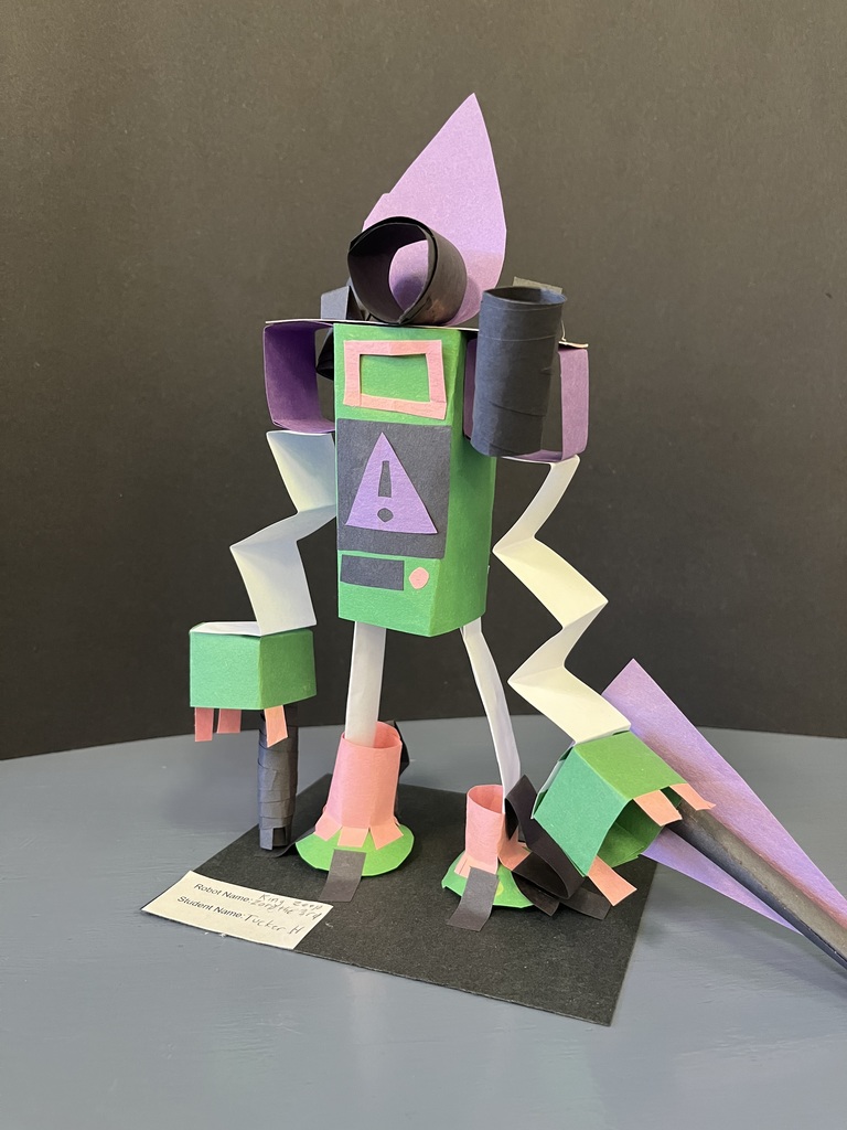 robot made out of multicolored folded construction paper