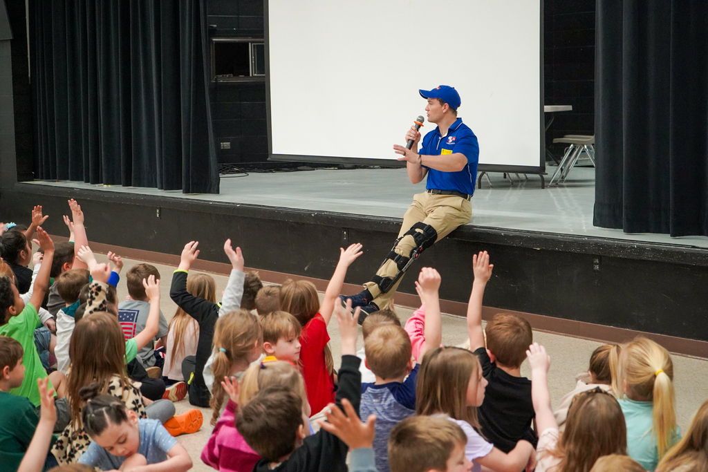 Darby Bybee talking to kindergartners in a weather assembly