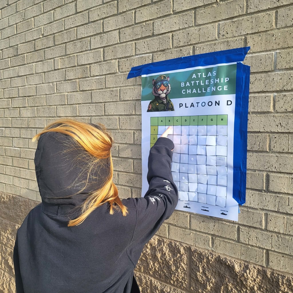 Student finds coordinate on giant battleship board.