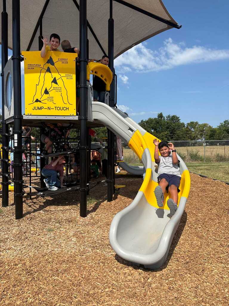 Students using the new playground equipment