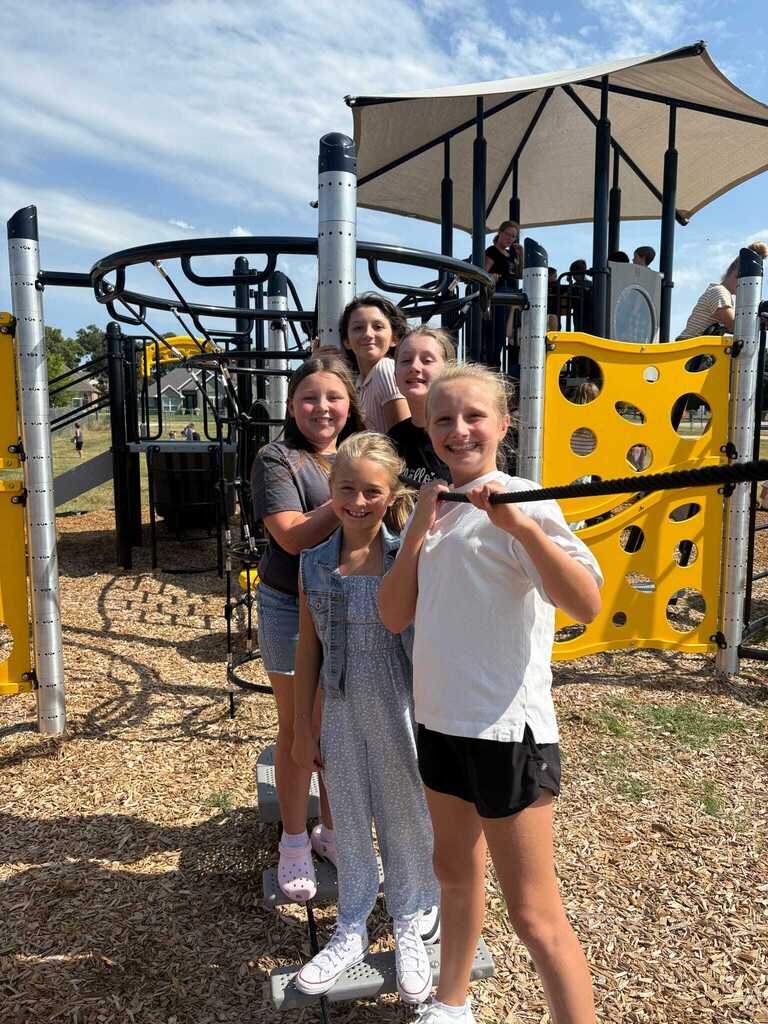 Students using the new playground equipment
