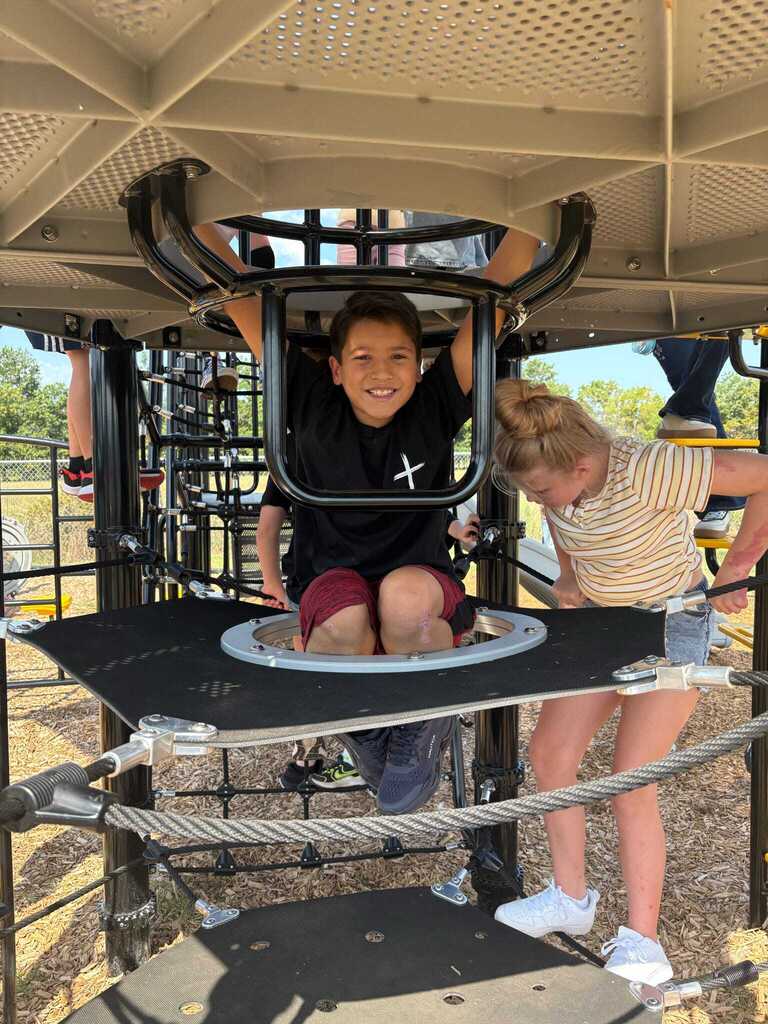 Students using the new playground equipment