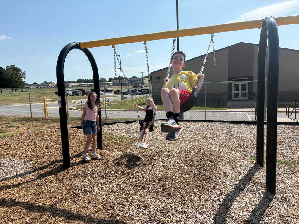 Students using the new playground equipment