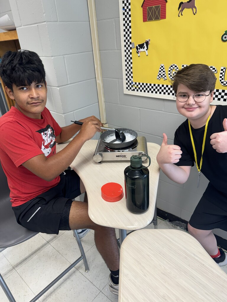 Students melt materials for soap molds