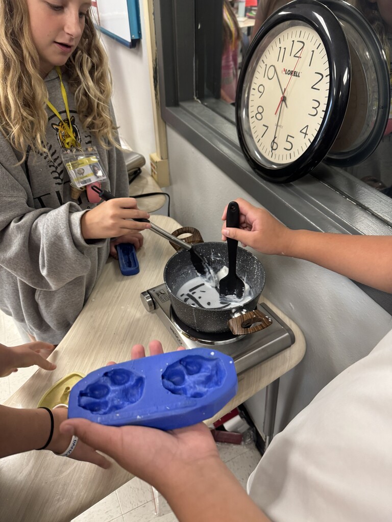Students get ready to fill animal track molds with soap