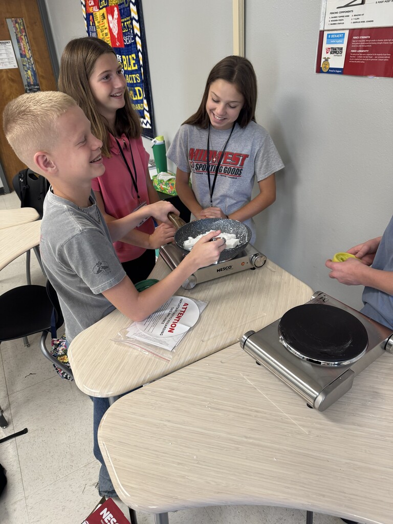 Students melt materials for soap molds