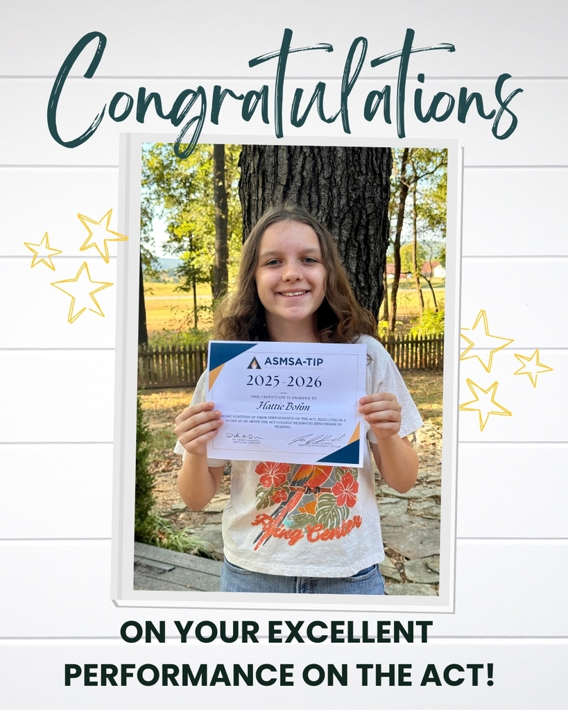 Hattie holds her recognition award for her high ACT Reading score