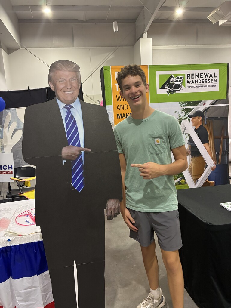 Posing with a cutout of the President at the Arkansas Oklahoma State Fair