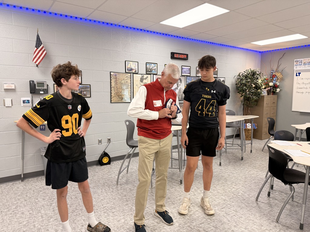 Congressman Steve Womack demonstrates folding the flag