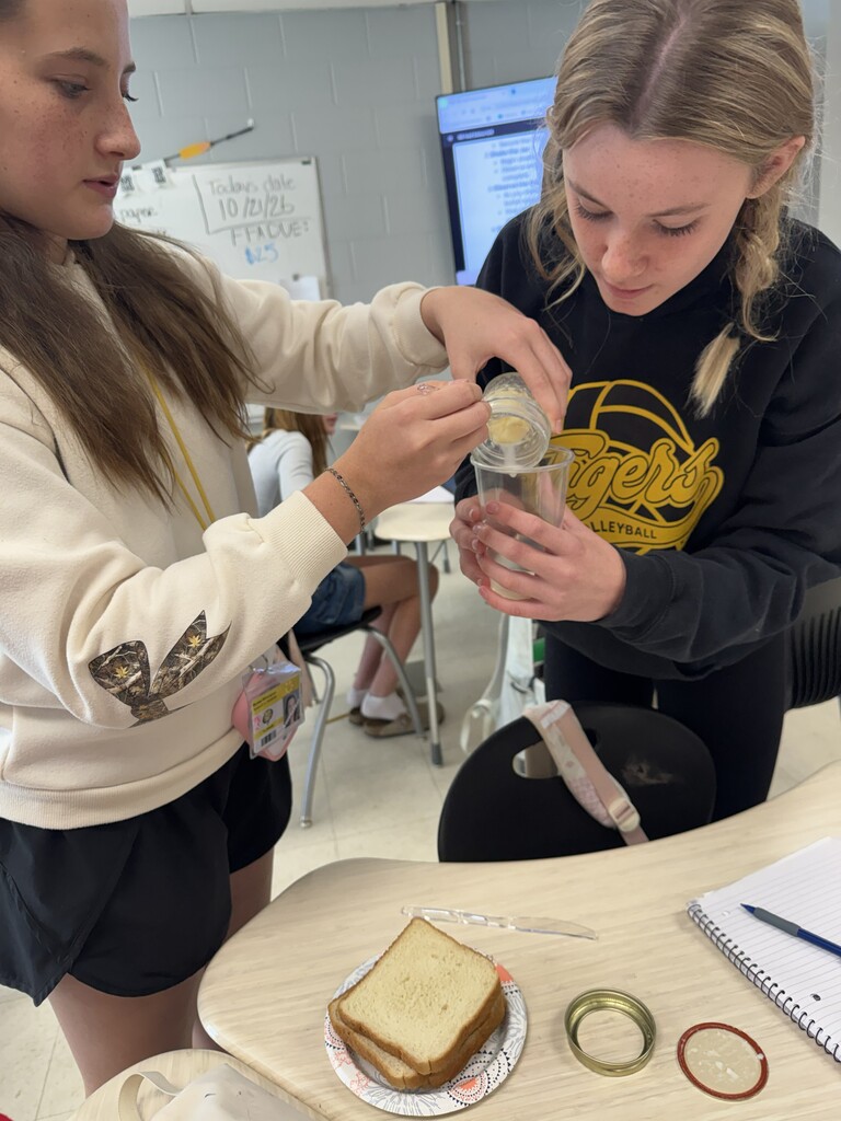 Two students separate their butter