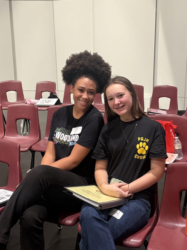 Choir students pose for a photo together.