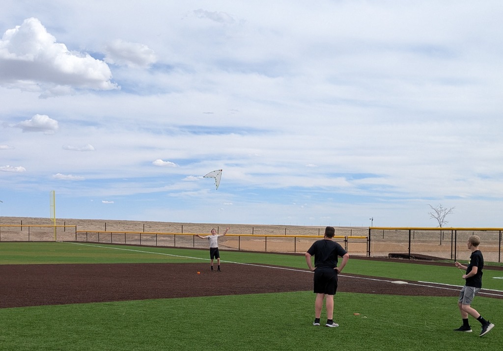 Geometry students flying kites