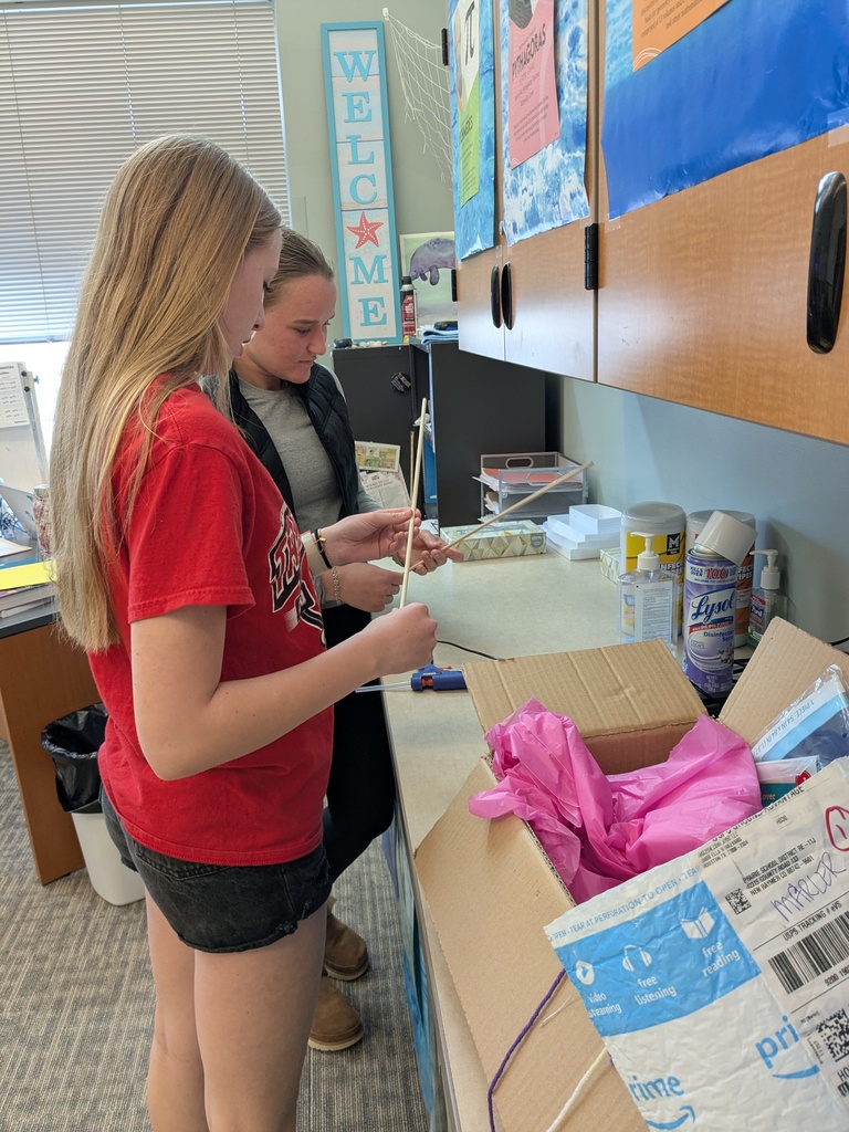 students work on building kites