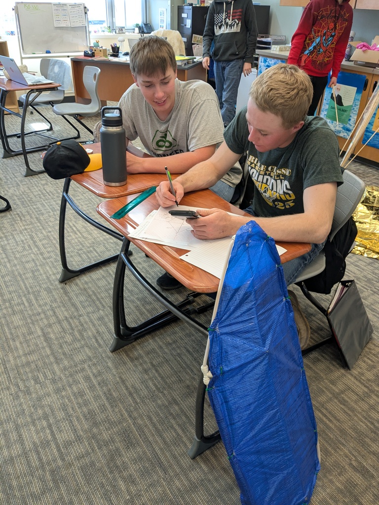 students work on building kites
