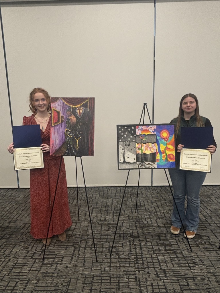 Students with their award and artwork
