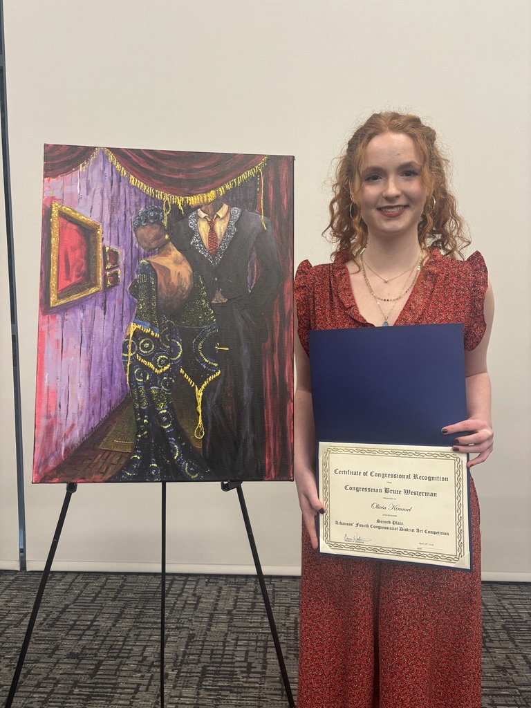 Student with her award and artwork