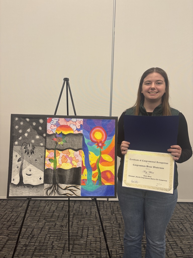Student with her award and artwork