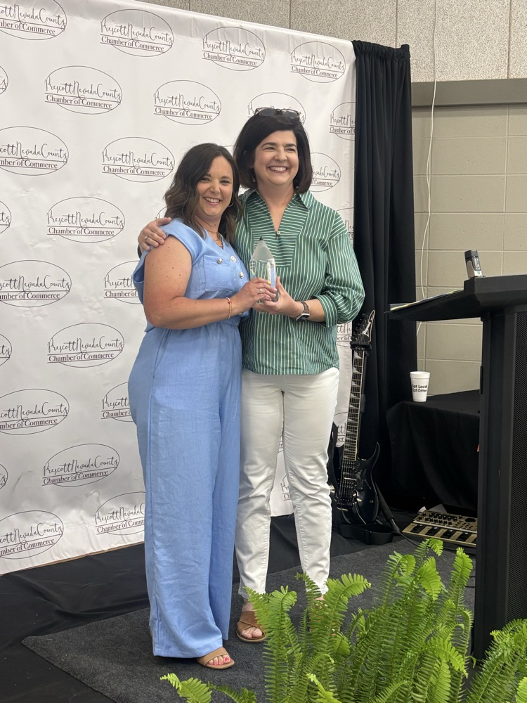 Teacher of the Year, Jessi with principal Grimes