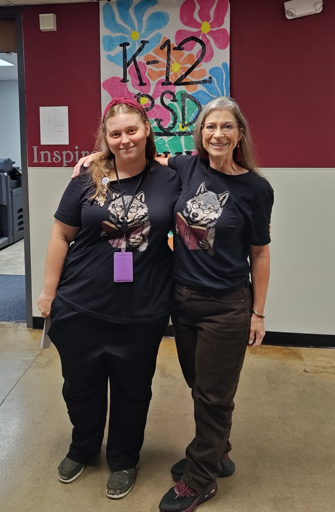 teachers posing in the hallway
