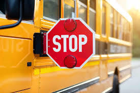 school bus with red stop sign out
