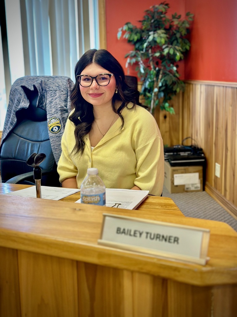 students pose with board members to be recognized for achievement