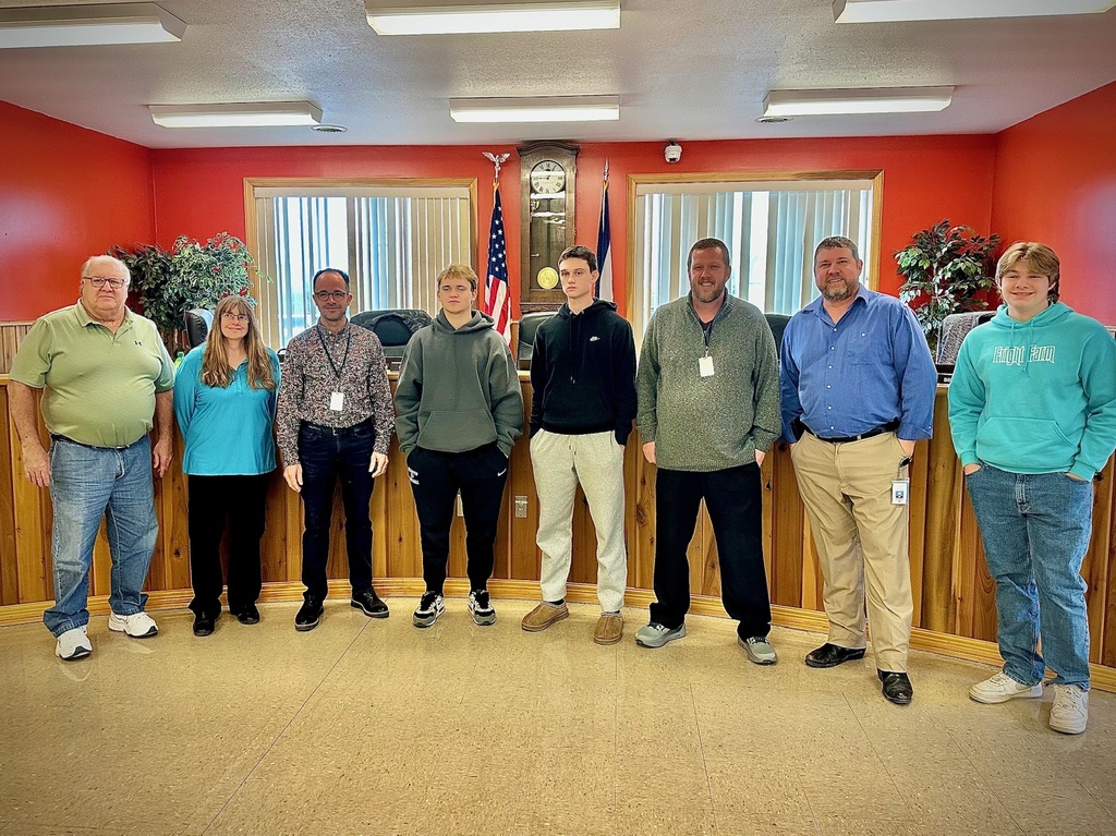students pose with board members to be recognized