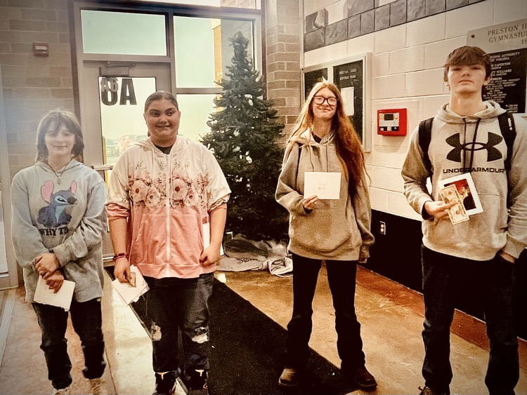 students pose with awards