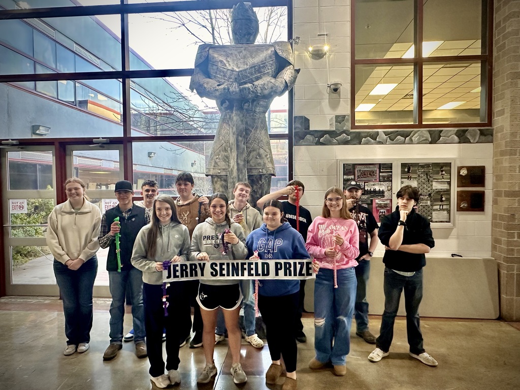 students pose with award