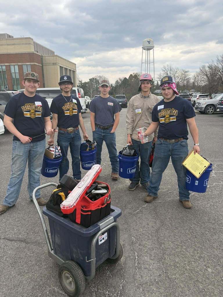 student poses with award