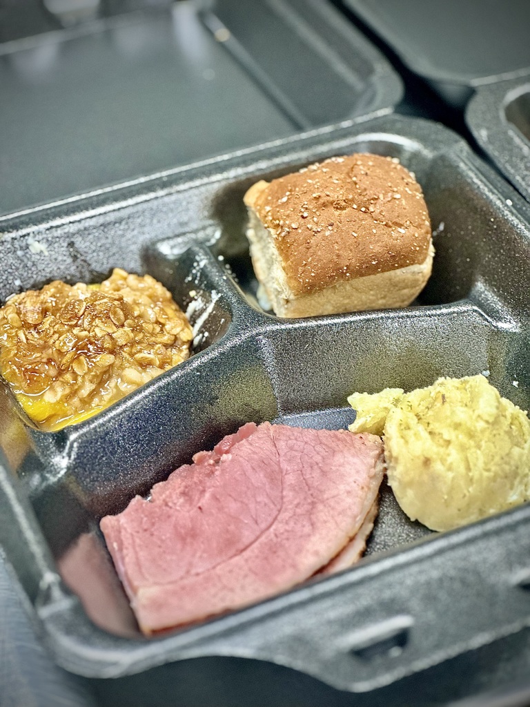 lunch tray with ham, potatoes, roll