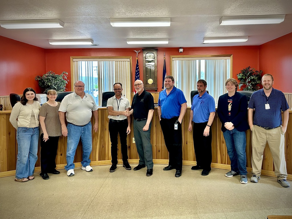 students pose with board members to be recognized